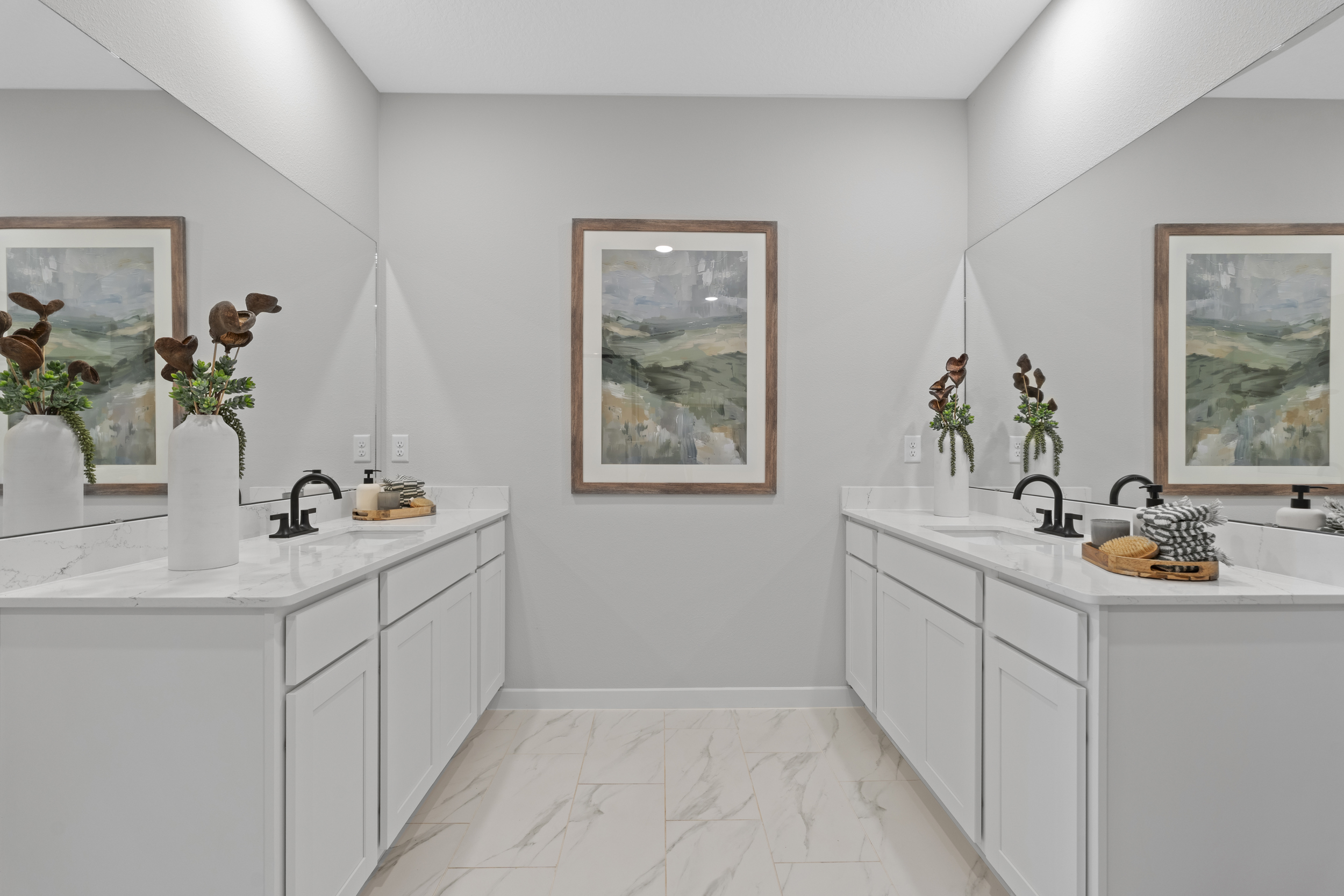 Kenai Model Home Two Primary Bathroom Sink Counters Across From Each Other at Reserve East in Flagler Beach