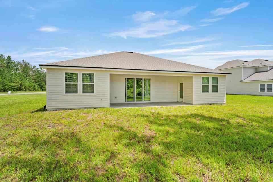 Dogwood Plan Lot 581 Rear Exterior with Covered Patio at NorthShore in Kingsland
