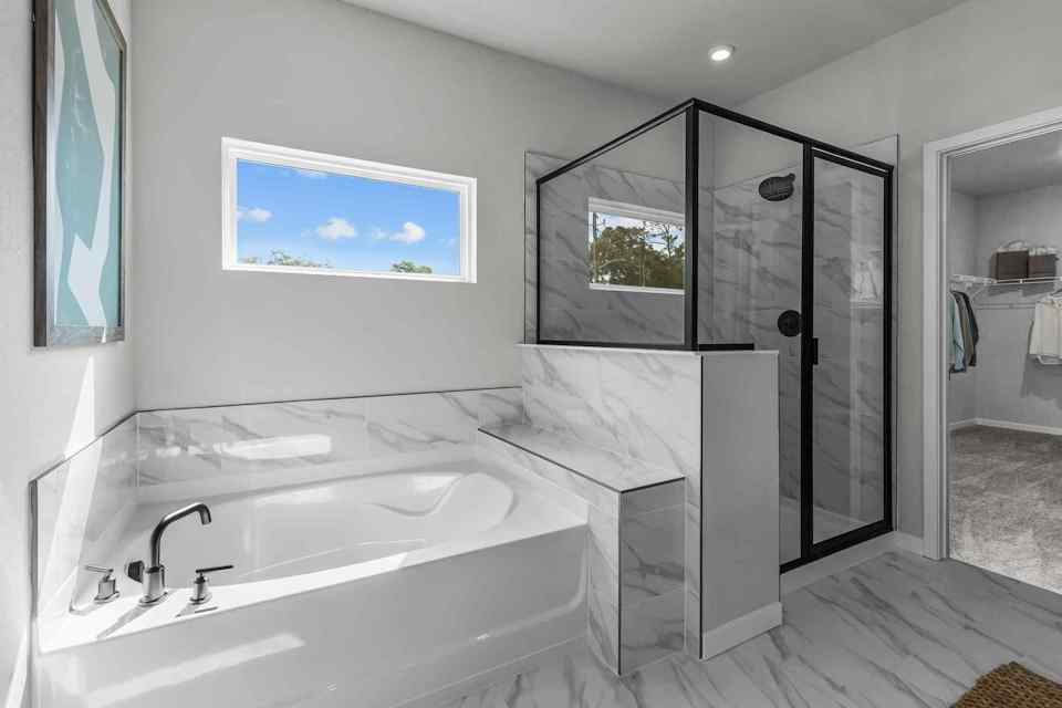 A bathroom with a glass shower.