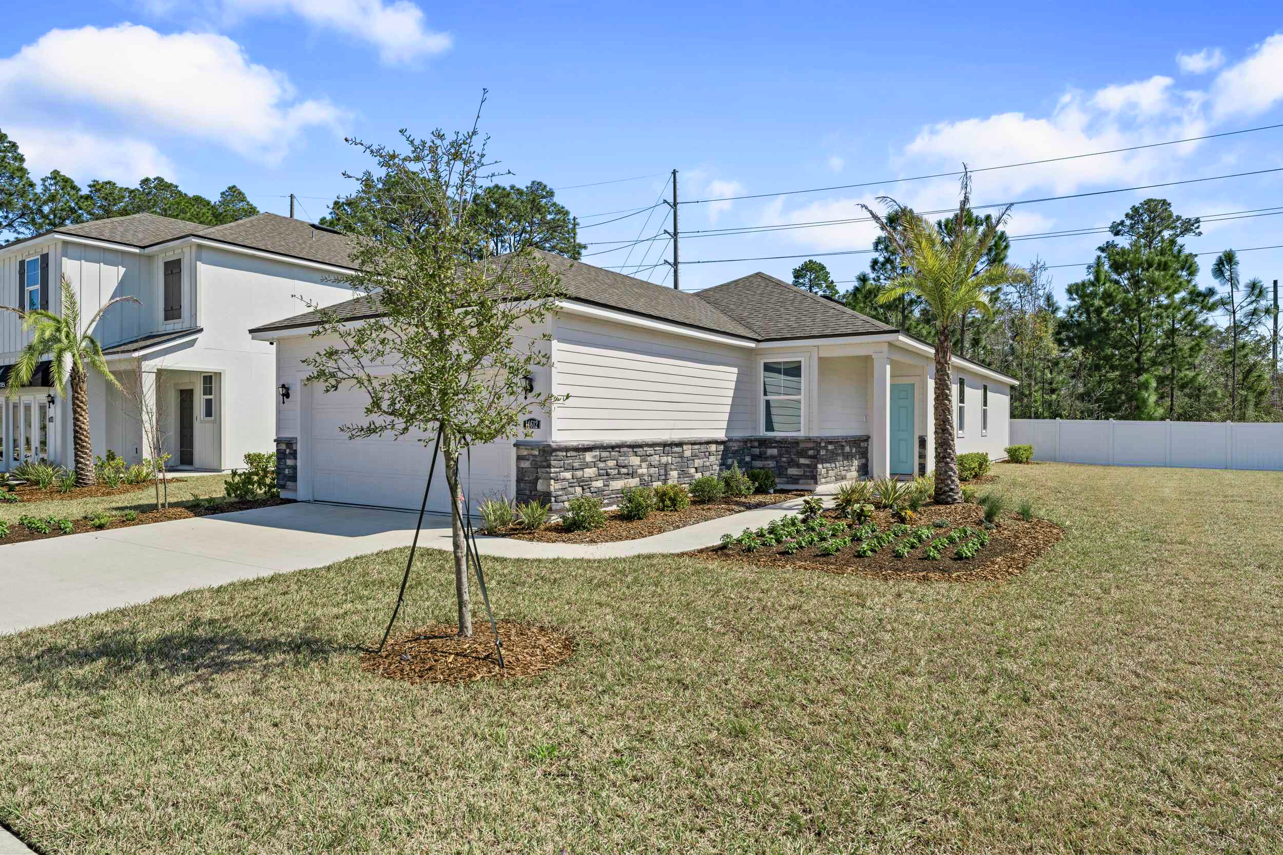A house with trees and grass.