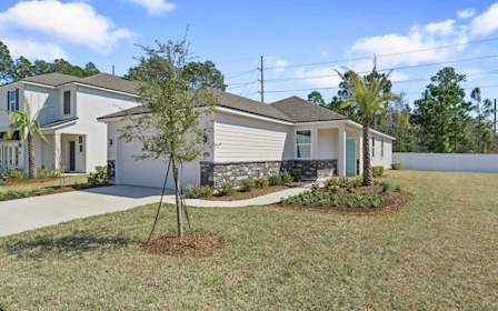 A house with trees and grass.