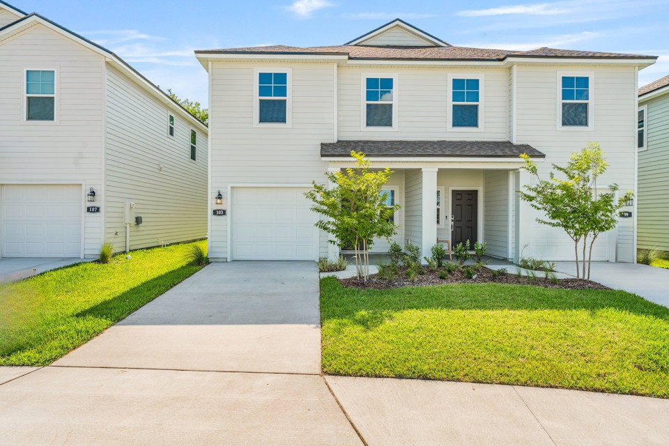 Davor Paired Home with Tan Exterior at The Landings at Pecan Park in Jacksonville