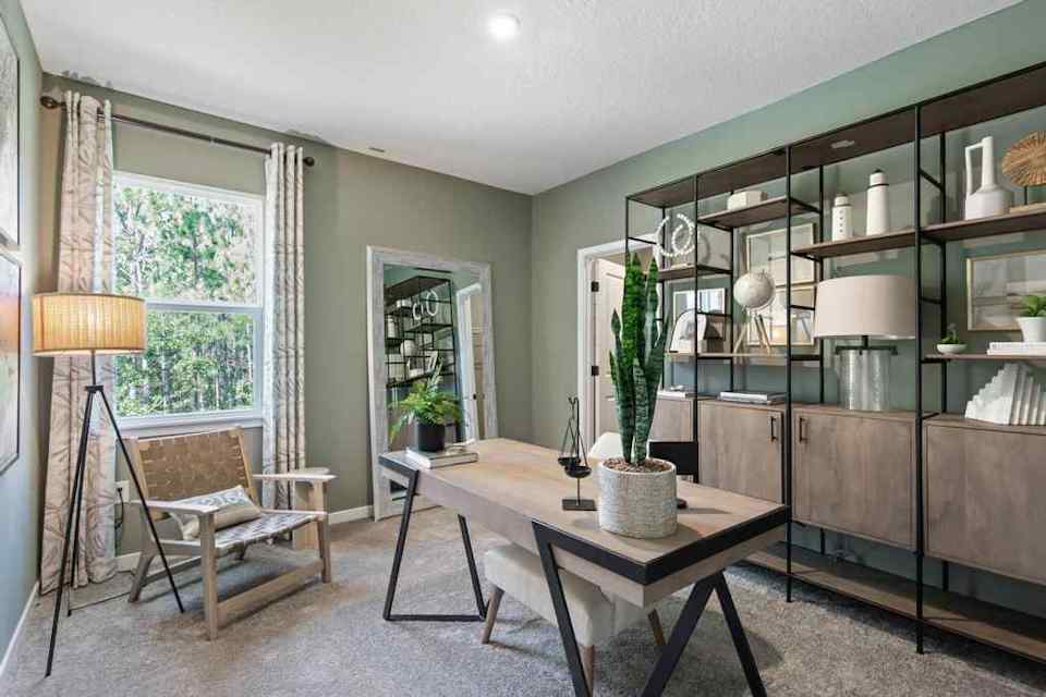 A room with a table and chairs.