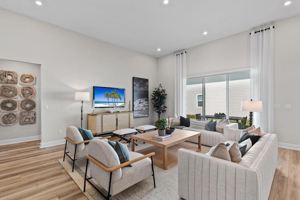 A living room with a tv and couches.