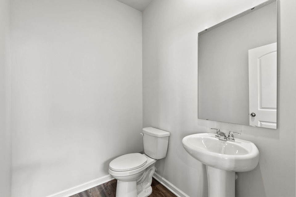 A bathroom with a toilet and sink.