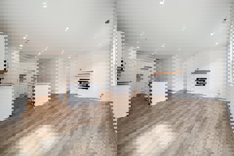 A large kitchen with white cabinets.