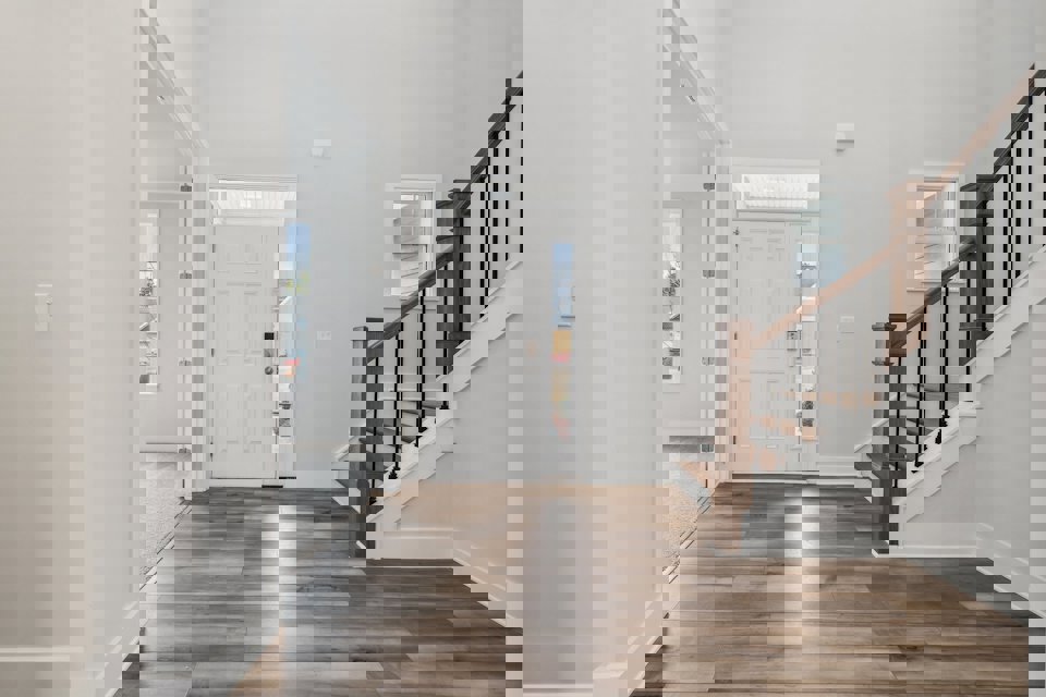 A hallway with white doors.