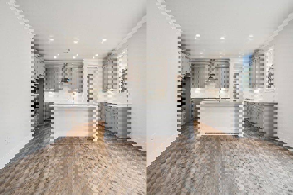 A kitchen with white cabinets.