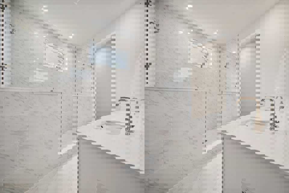 A bathroom with a glass shower.