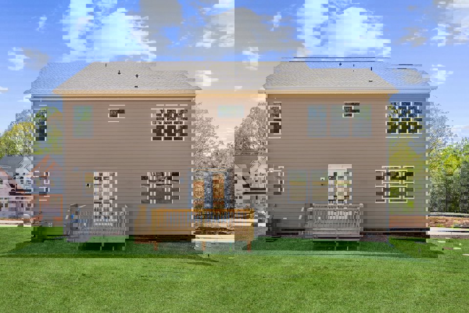 A house with a fence in the front.