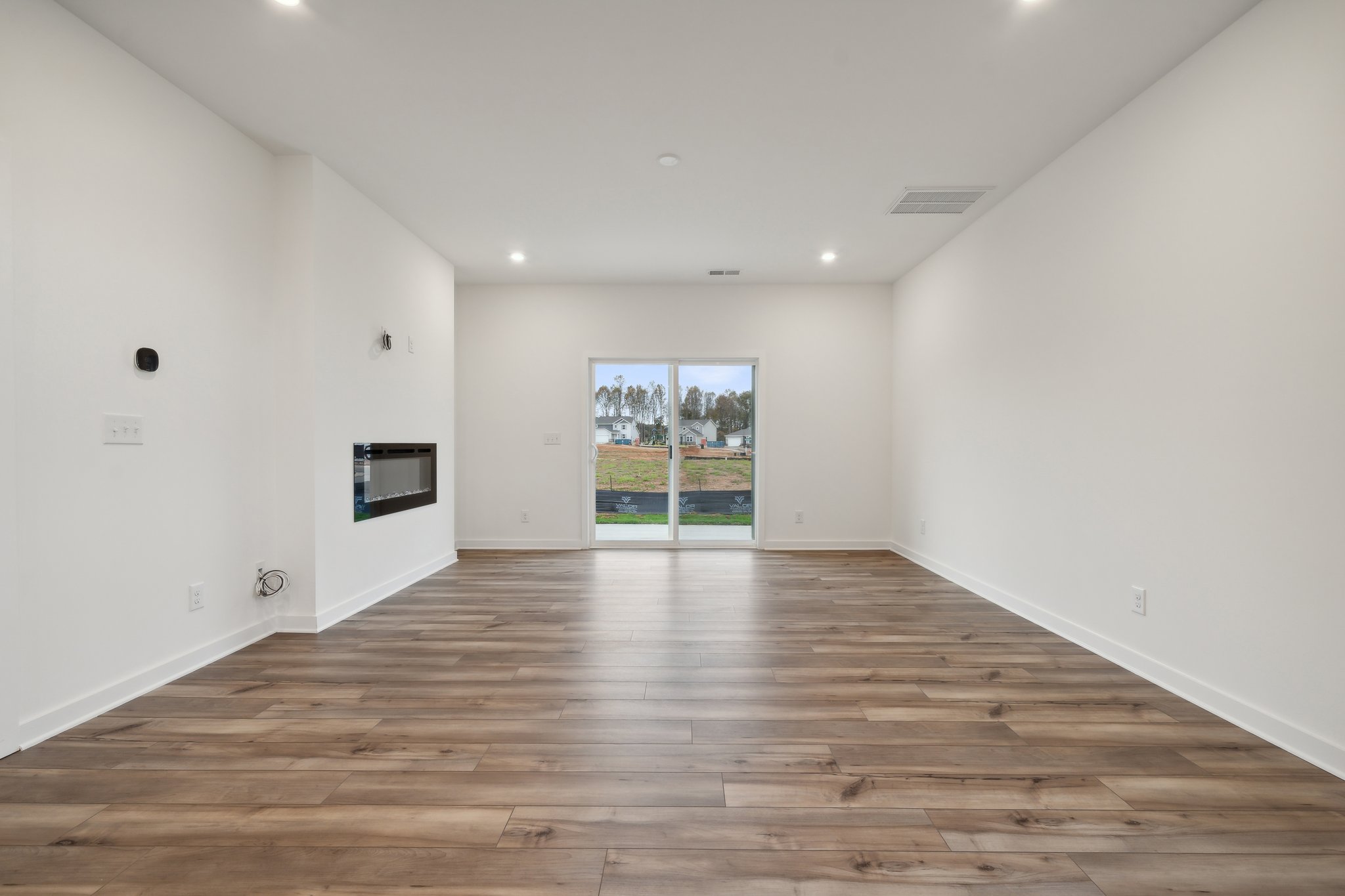A room with a wood floor and a wood floor.
