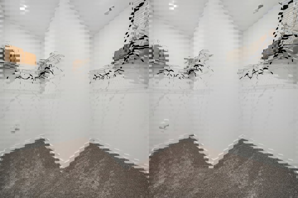 A white room with a staircase.