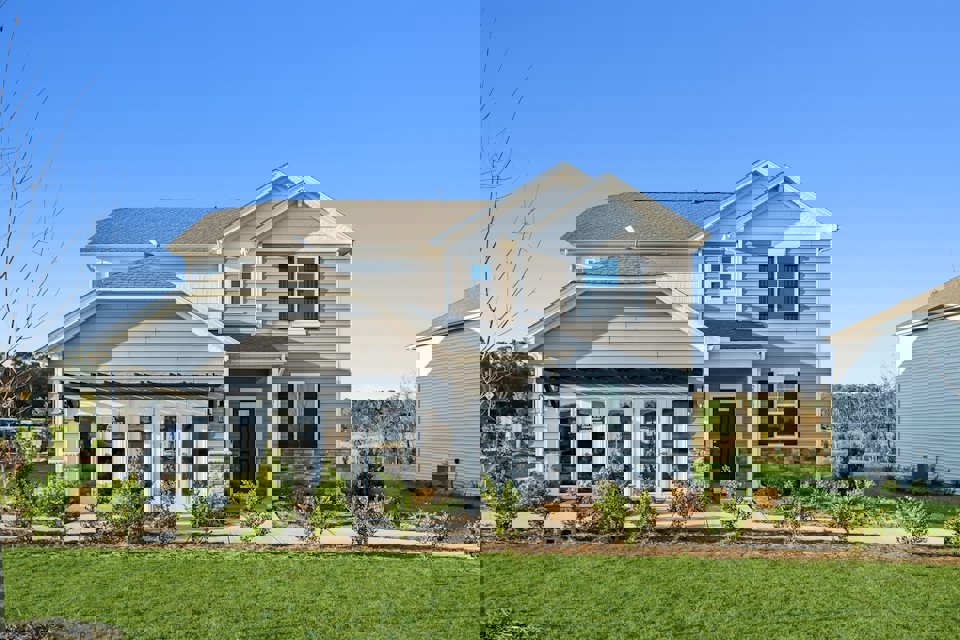 A house with a large front yard.