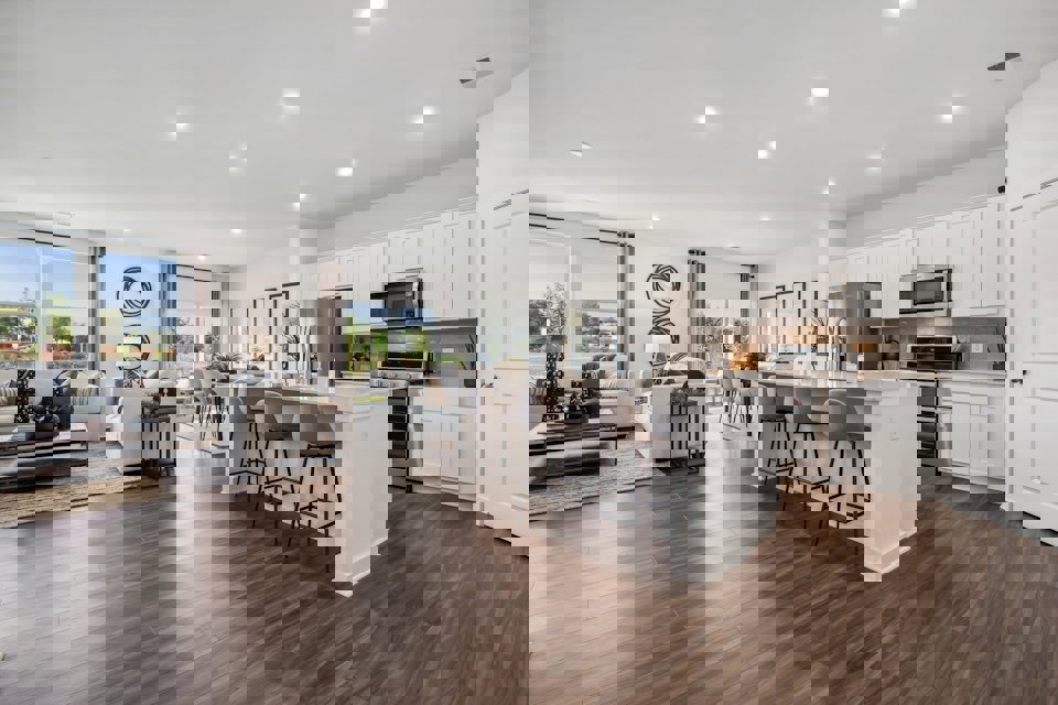 A large kitchen with white cabinets.