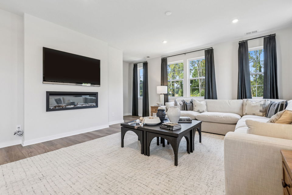 A living room with a large tv.