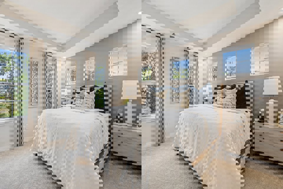 A bedroom with a large bed.