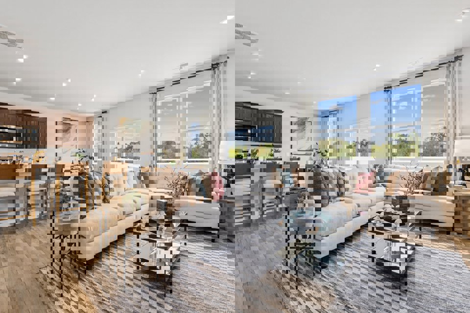 A large living room with a large window.