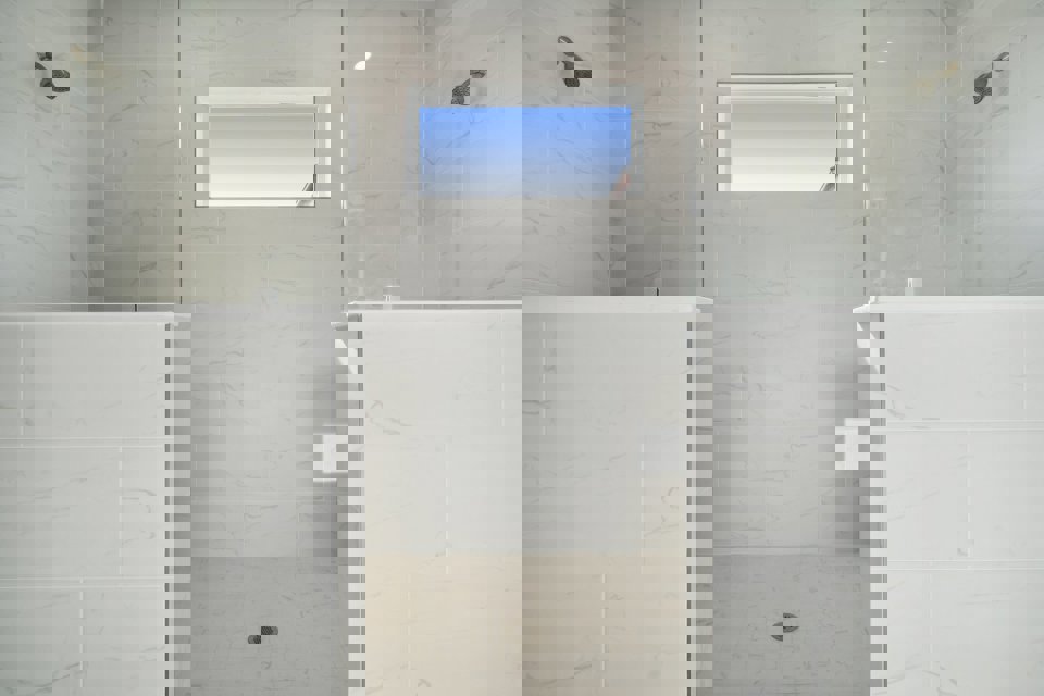 A bathroom with a window.