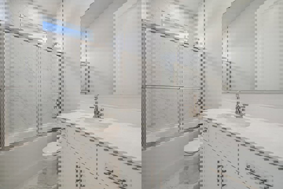 A bathroom with a glass shower.