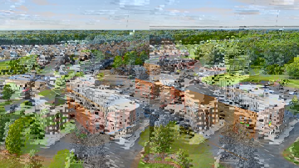 A large building with a parking lot.