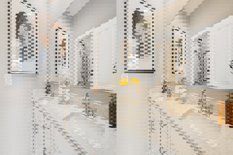 A bathroom with a couple of sinks.