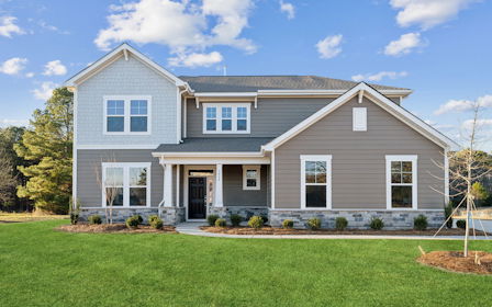 A house with a lawn in front.