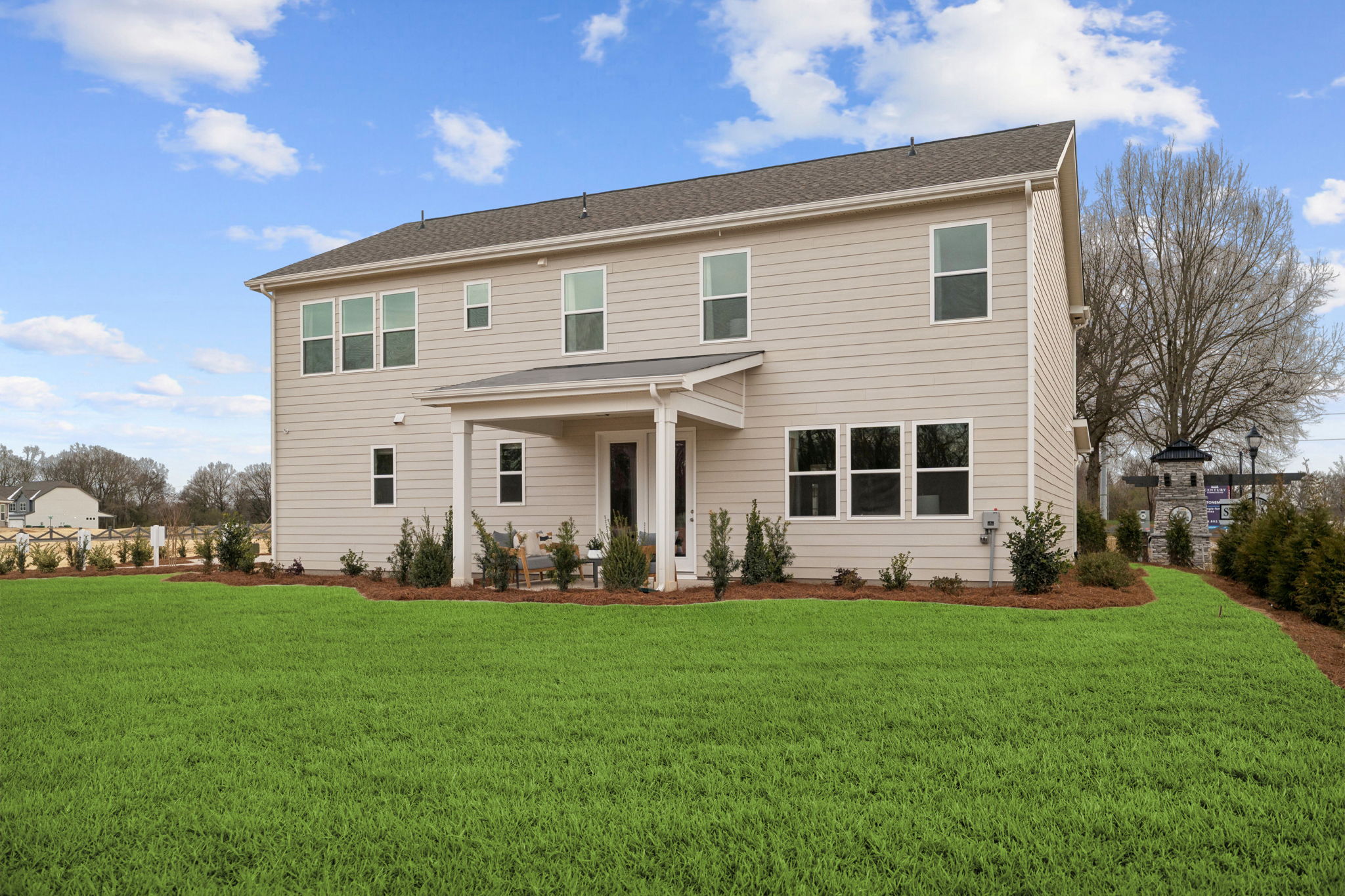 A house with a large front yard.
