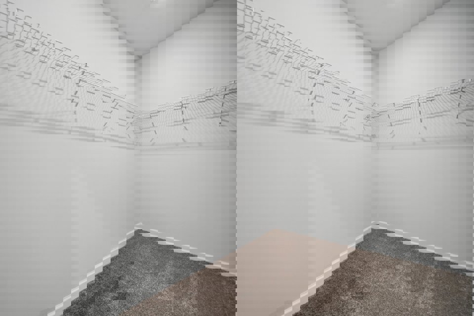 A hallway with white walls.