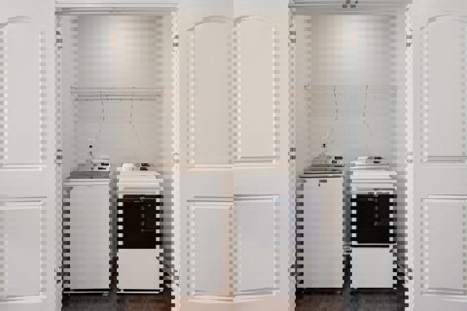 A small kitchen with white cabinets.