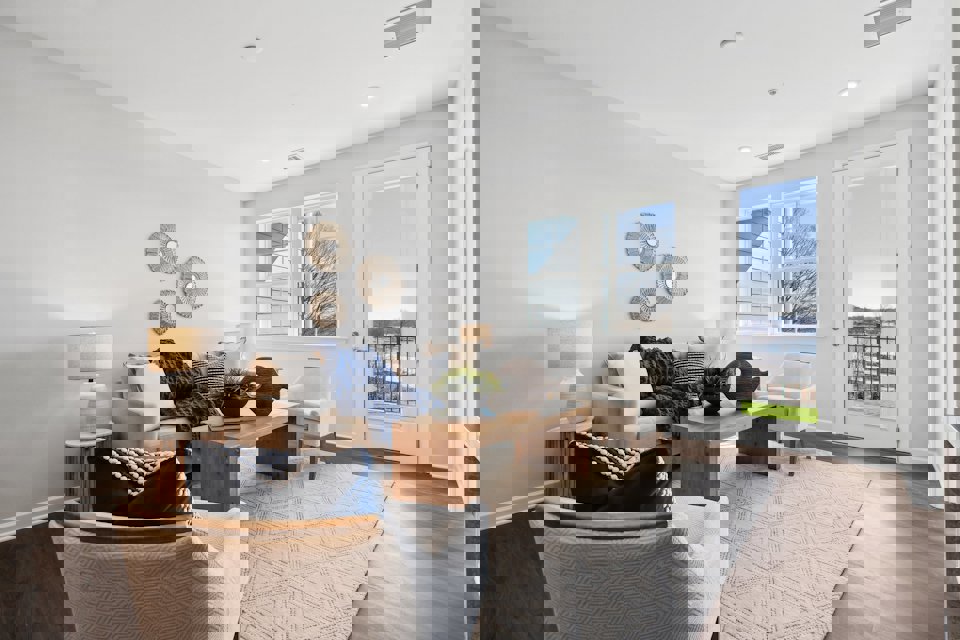 A living room with a couch and a table.