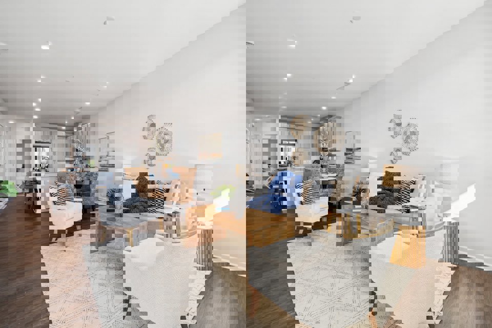 A living room with a wood floor.