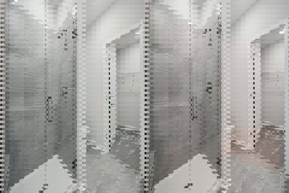 A bathroom with a glass shower.