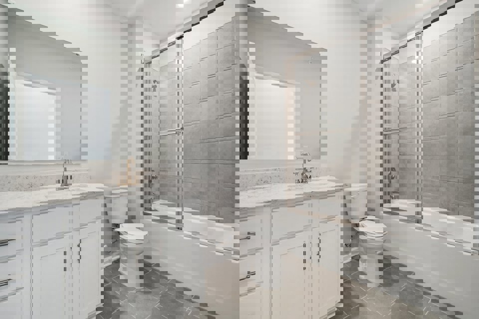 A bathroom with a glass shower.