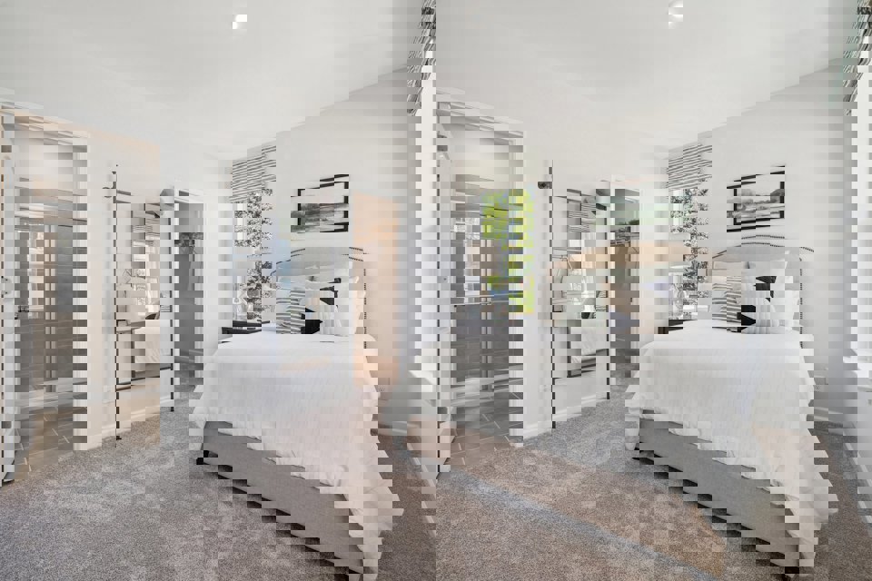 A bedroom with a large bed.