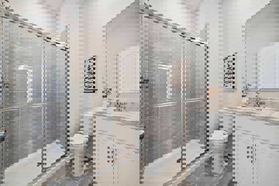 A bathroom with a glass shower.