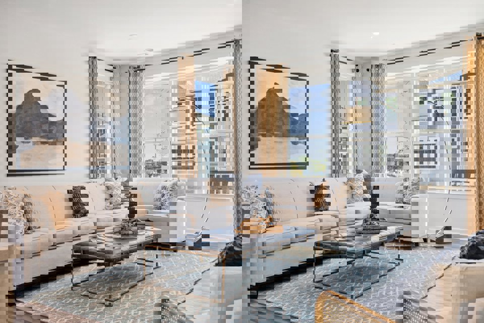 A living room with a large window.