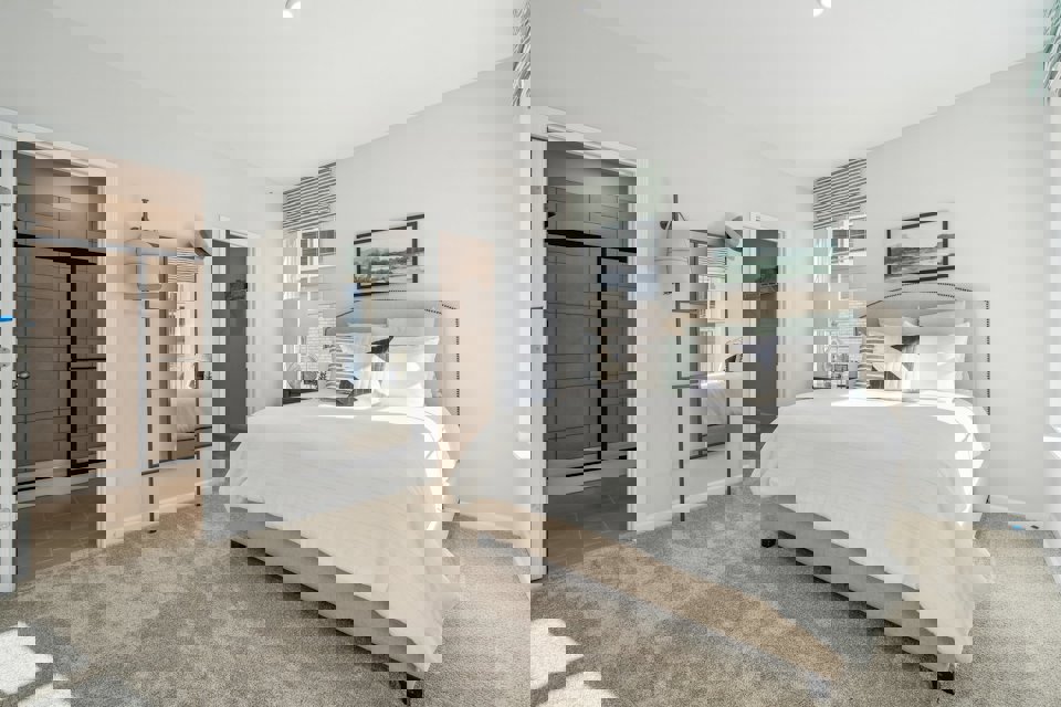 A bedroom with a large bed.