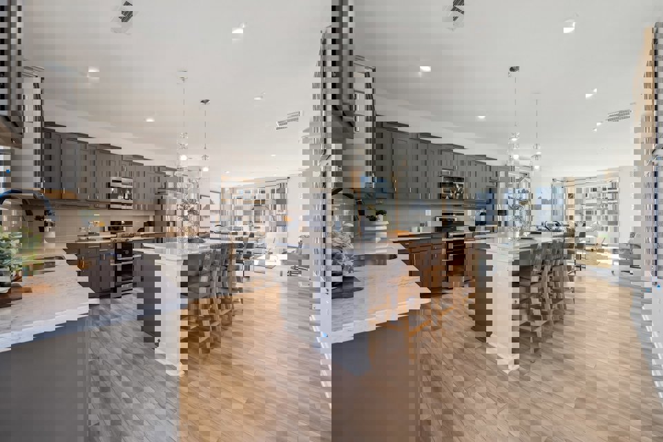 A kitchen with a wood floor.