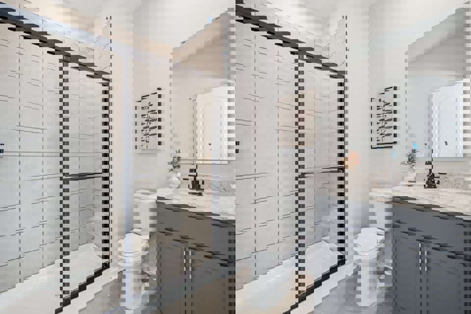 A bathroom with a glass shower.