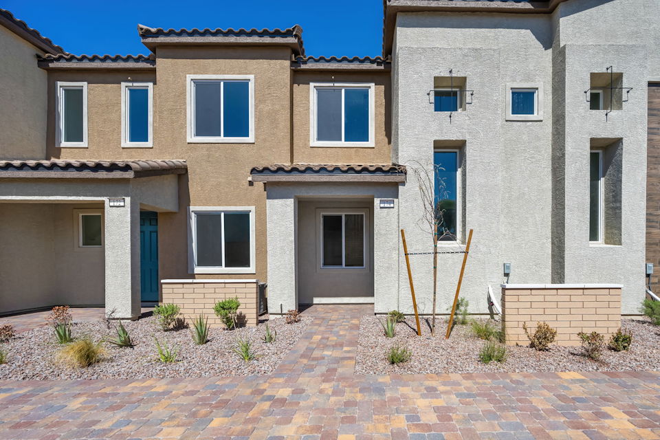 A large building with a brick patio.