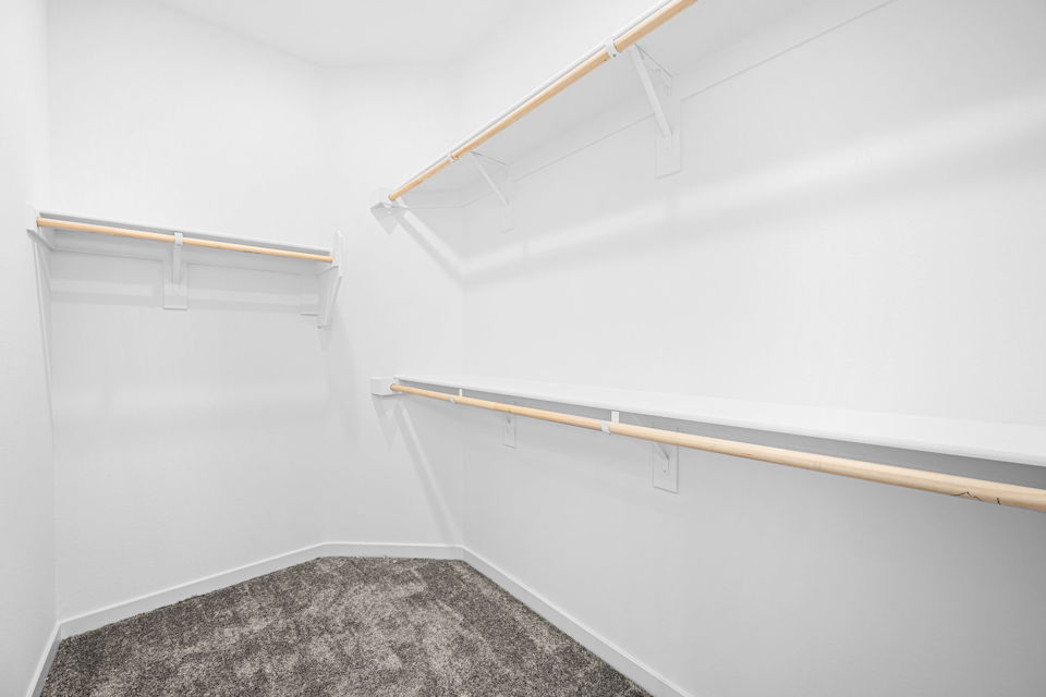 A white wall with a wooden ladder.