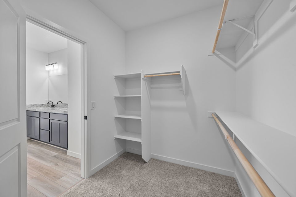 A white room with a glass door.