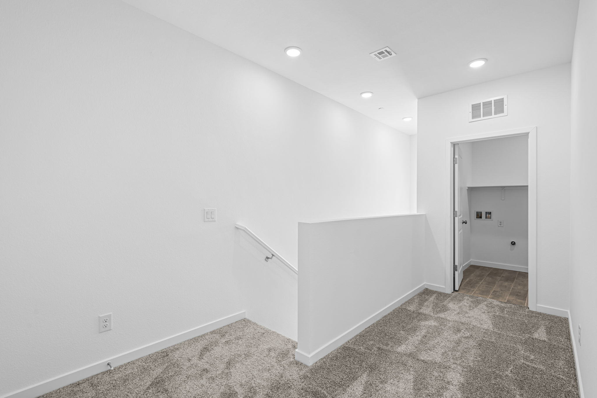 A room with a white wall and a white floor.