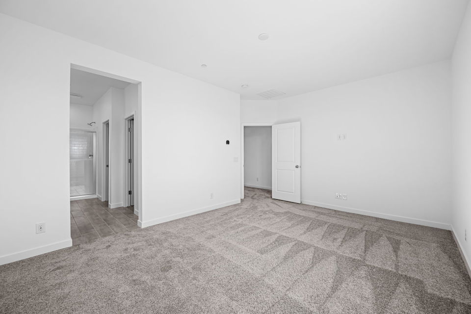 A hallway with white walls.