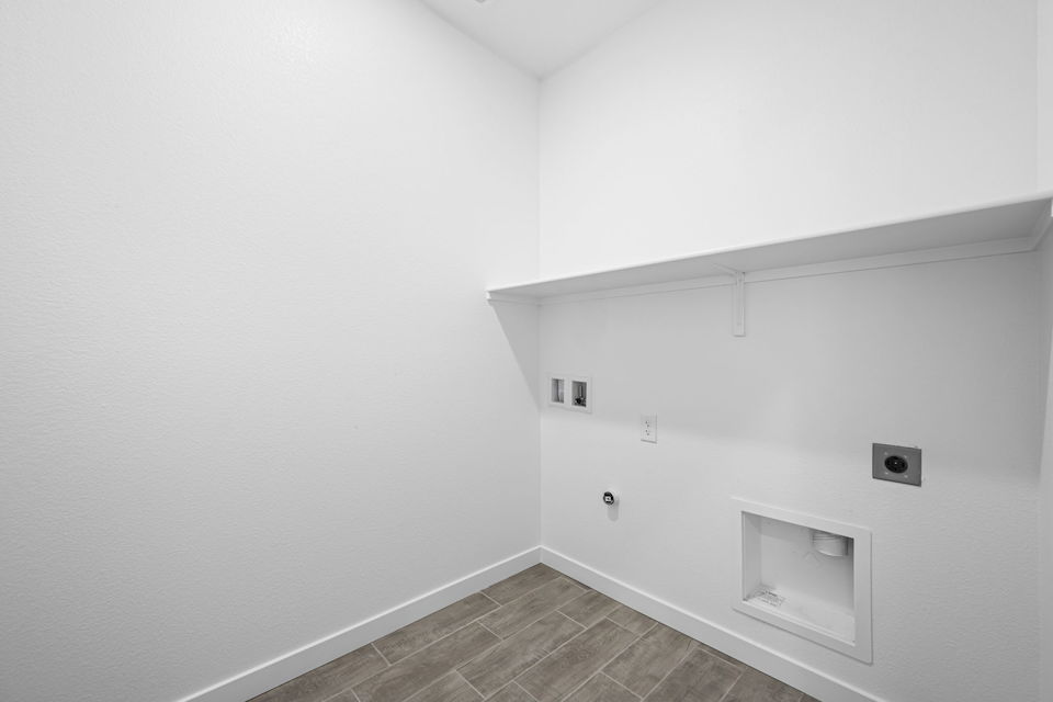A white wall with a vent.