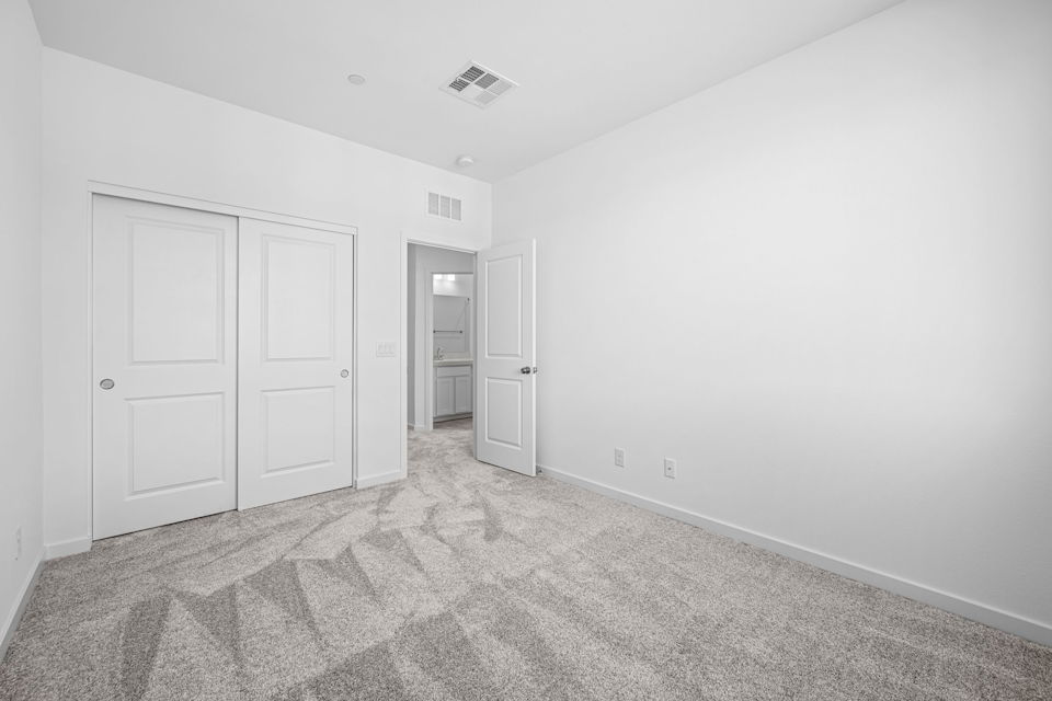 A hallway with white doors.