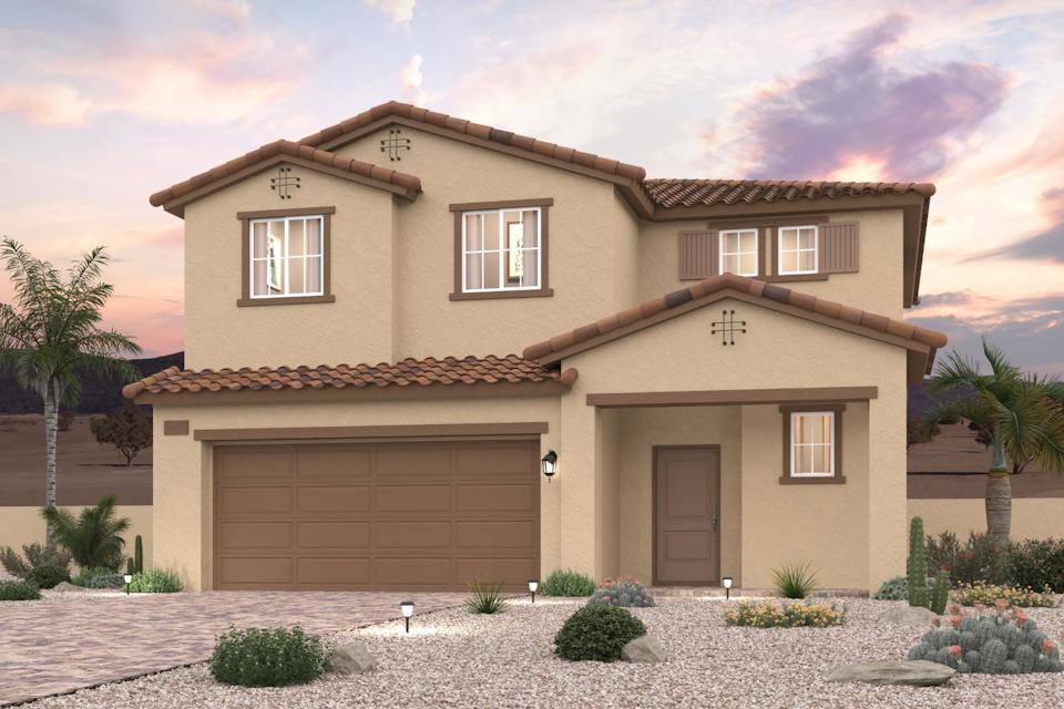 A house with a garage and palm trees.