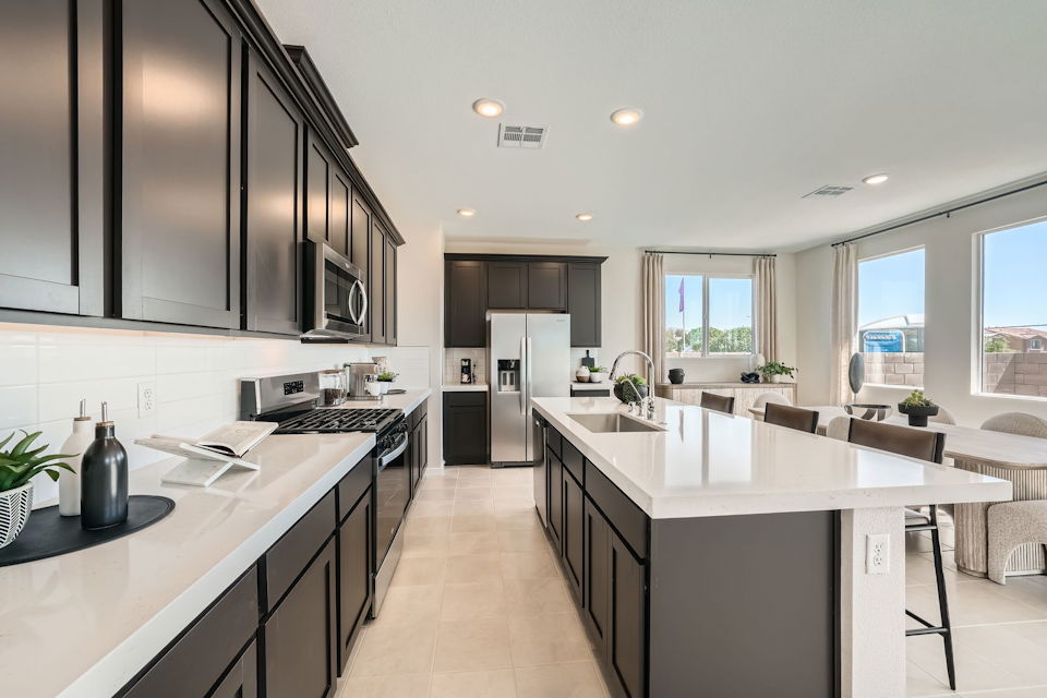 A kitchen with black appliances.
