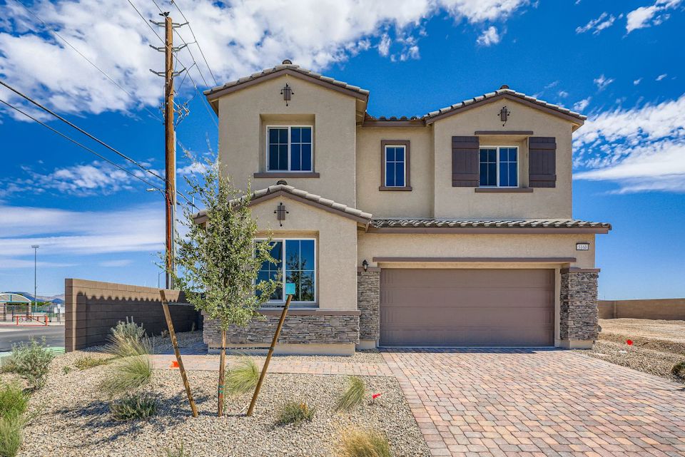 A house with a brick driveway.