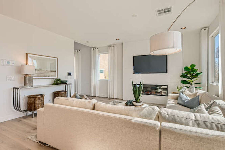 A living room with a tv and couches.